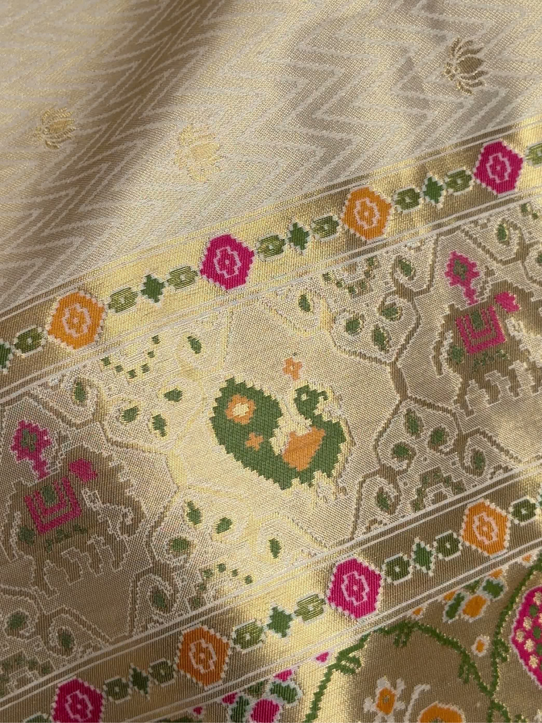Patola Weave Banarasi Silk Saree with Animal Motif in Cream