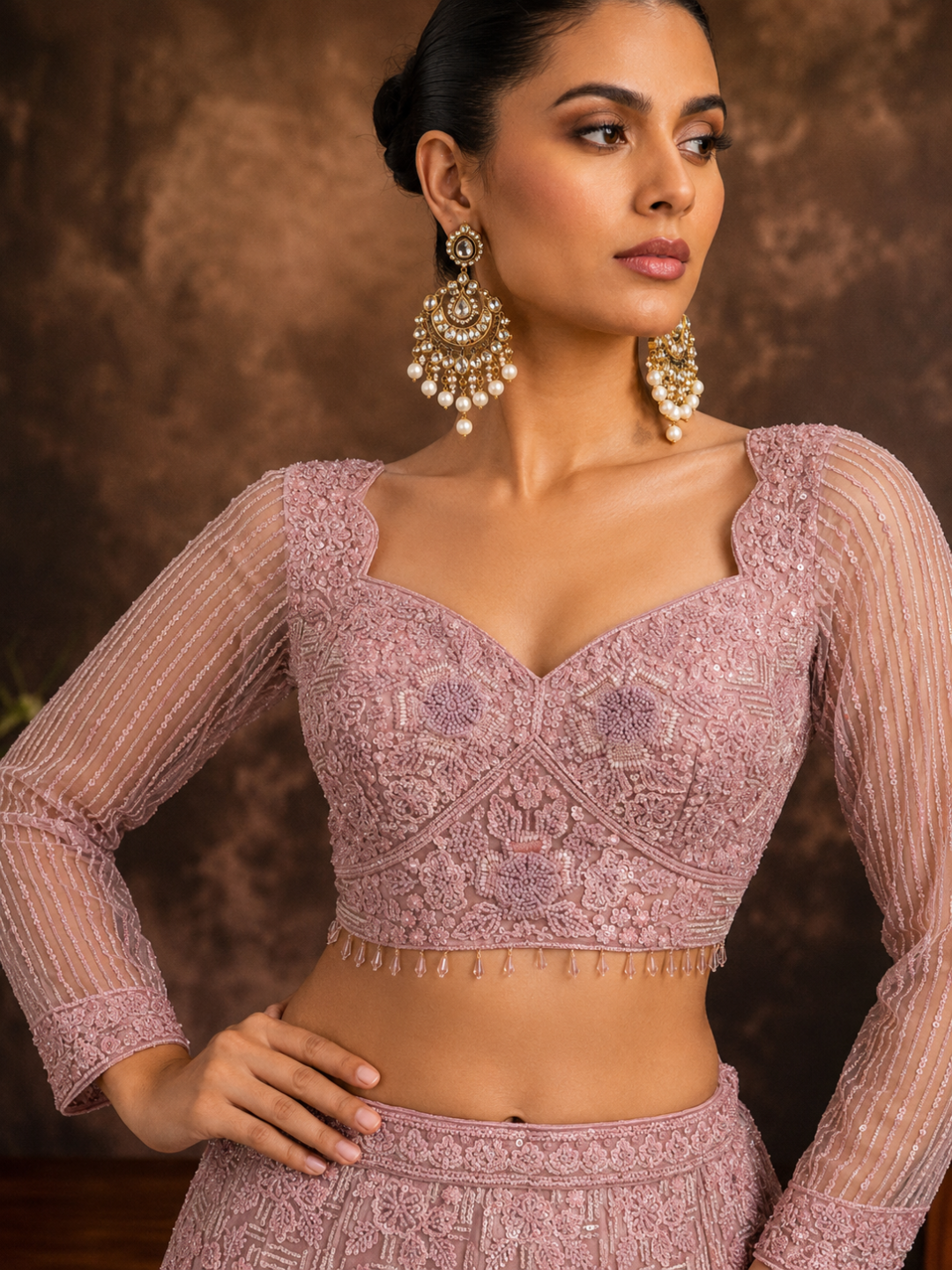 Dusty Pink Net Lehenga Choli with Heavy Resham, Cutdana & Pearl Embroidery with Sequin Striped Sleeves & Net Dupatta