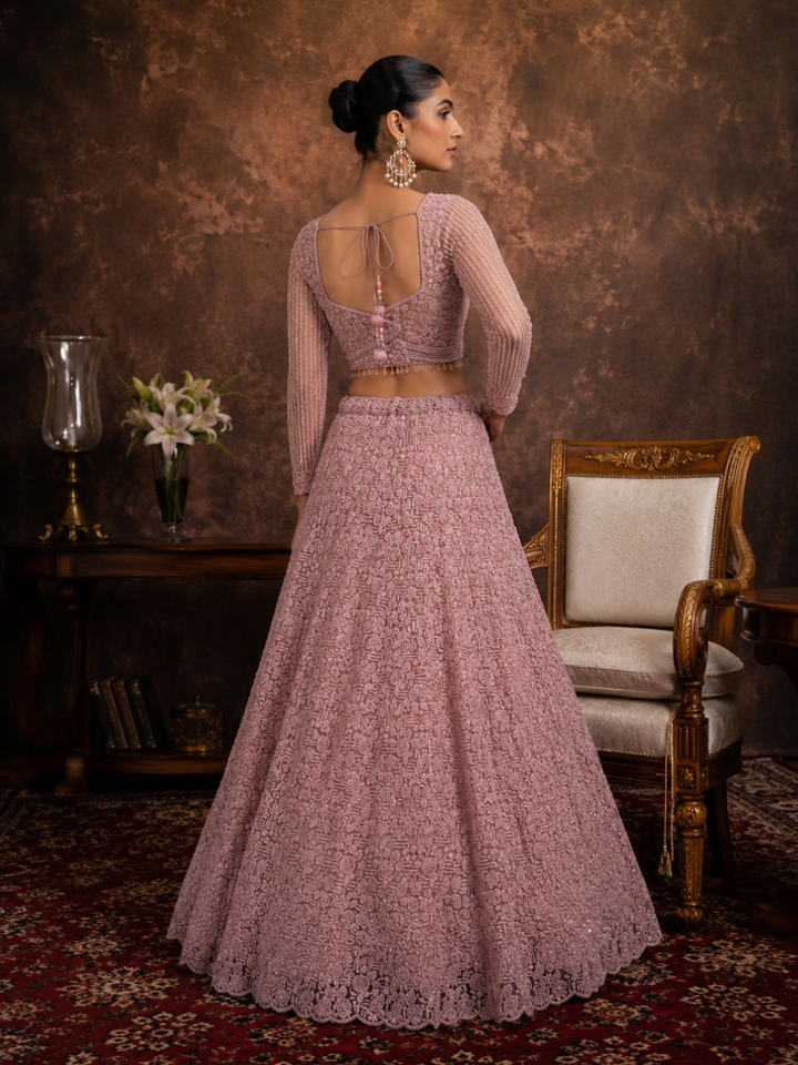 Dusty Pink Net Lehenga Choli with Heavy Resham, Cutdana & Pearl Embroidery with Sequin Striped Sleeves & Net Dupatta