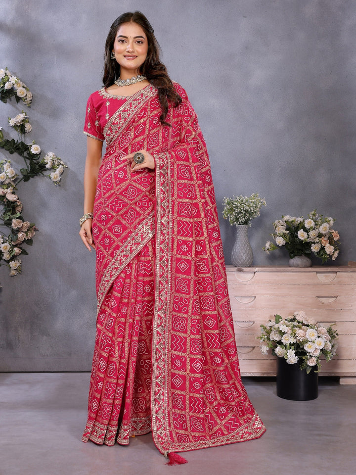 Bandhani-print saree with zari & mirror embellished border and embroidered blouse.