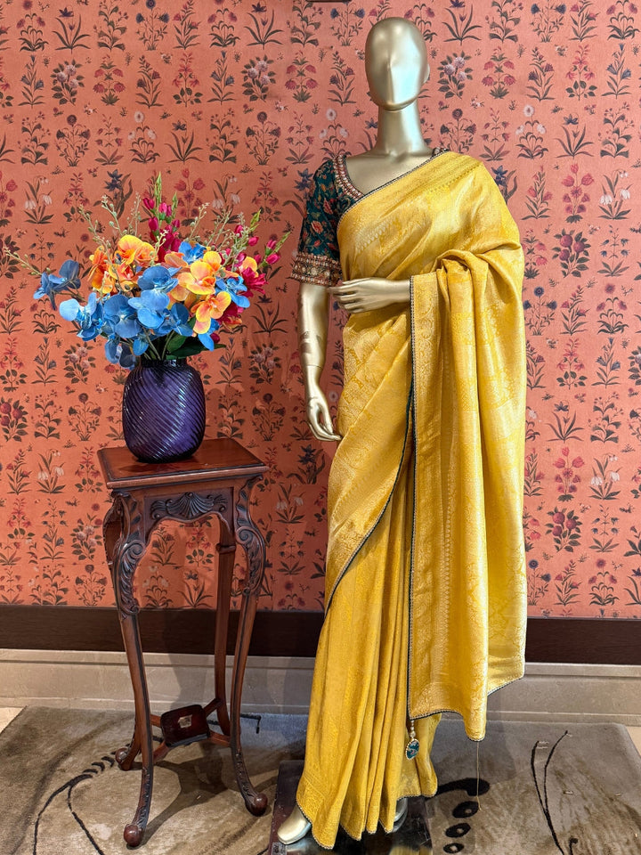 Yellow Jacquard Silk Woven Zari Saree with Slim Embellished Border for Festive Haldi Wear.