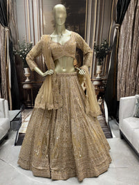 Champagne gold heavy sequin embroidered net lehenga set with scalloped border dupatta.