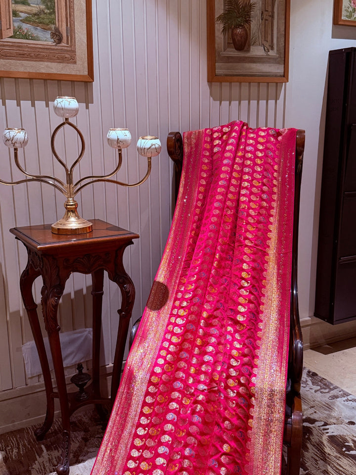 Pink Banarasi Saree with All-over Gold Zari Buta and Dual-Tone Geometric Woven Border