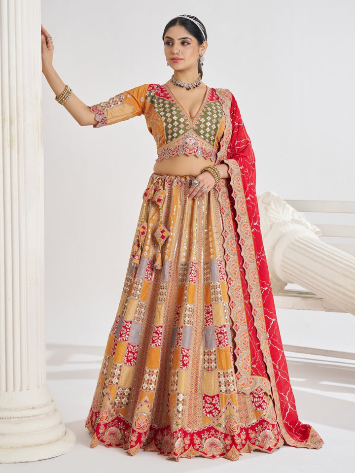 Multi-colour patchwork lehenga choli with mirror, zari & gota embroidery and bandhani dupatta.