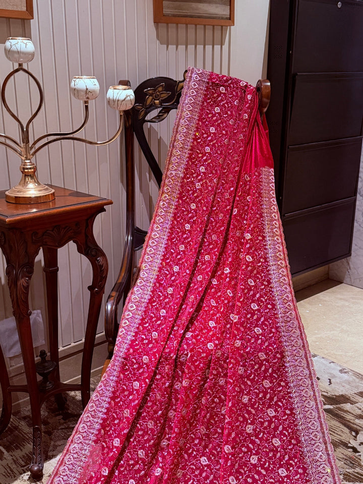 Pinkish Red Saree with Heavy Golden Zari Embroidery & Ornate Floral Motif Border Work