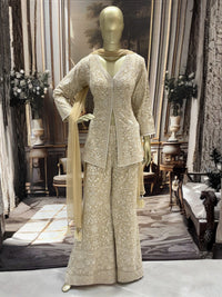 Ivory all-over thread embroidered kurta palazzo set with sequins and tasselled dupatta.