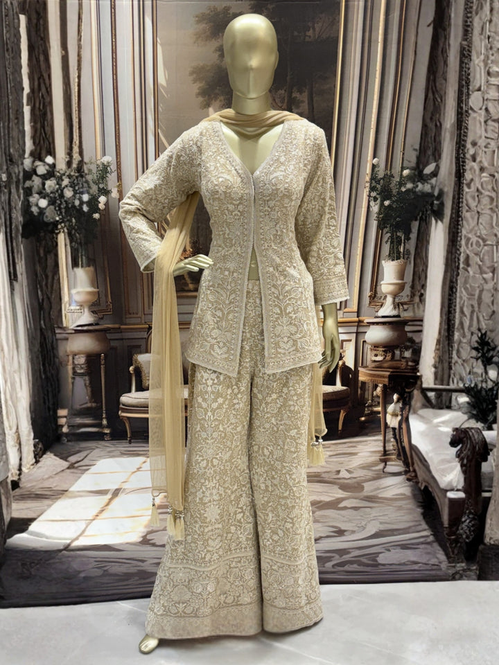 Ivory all-over thread embroidered kurta palazzo set with sequins and tasselled dupatta.