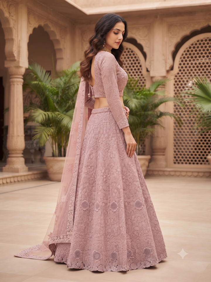 Dusty Pink Net Lehenga Choli with Heavy Resham, Cutdana & Pearl Embroidery with Sequin Striped Sleeves & Net Dupatta