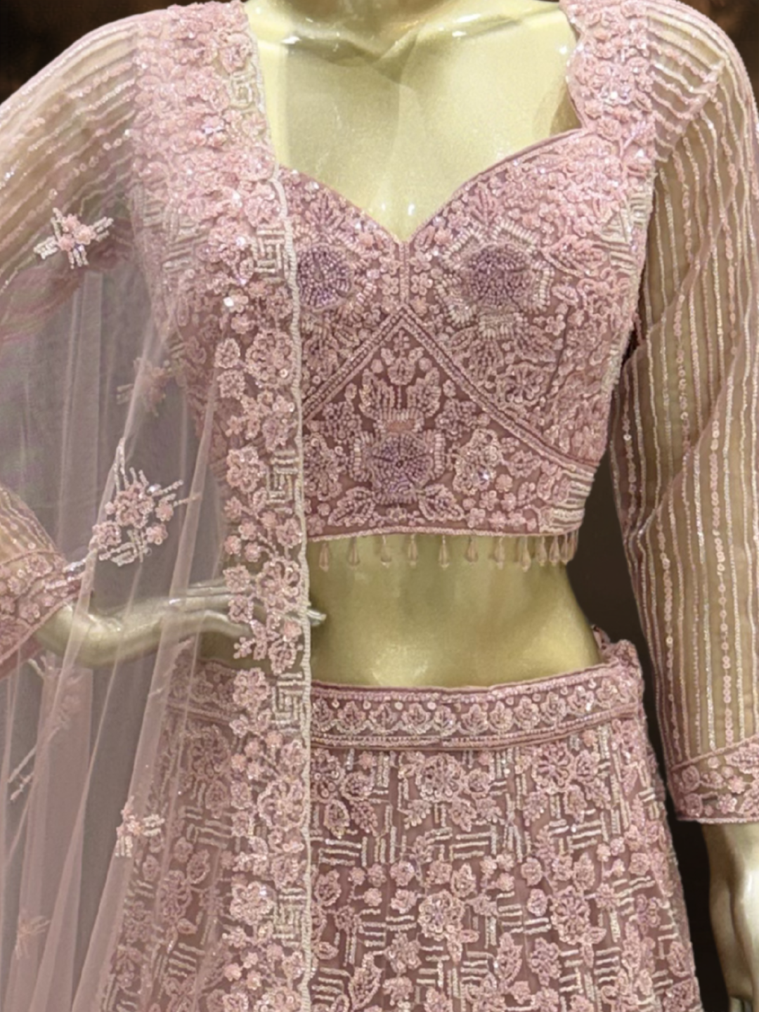 Dusty Pink Net Lehenga Choli with Heavy Resham, Cutdana & Pearl Embroidery with Sequin Striped Sleeves & Net Dupatta