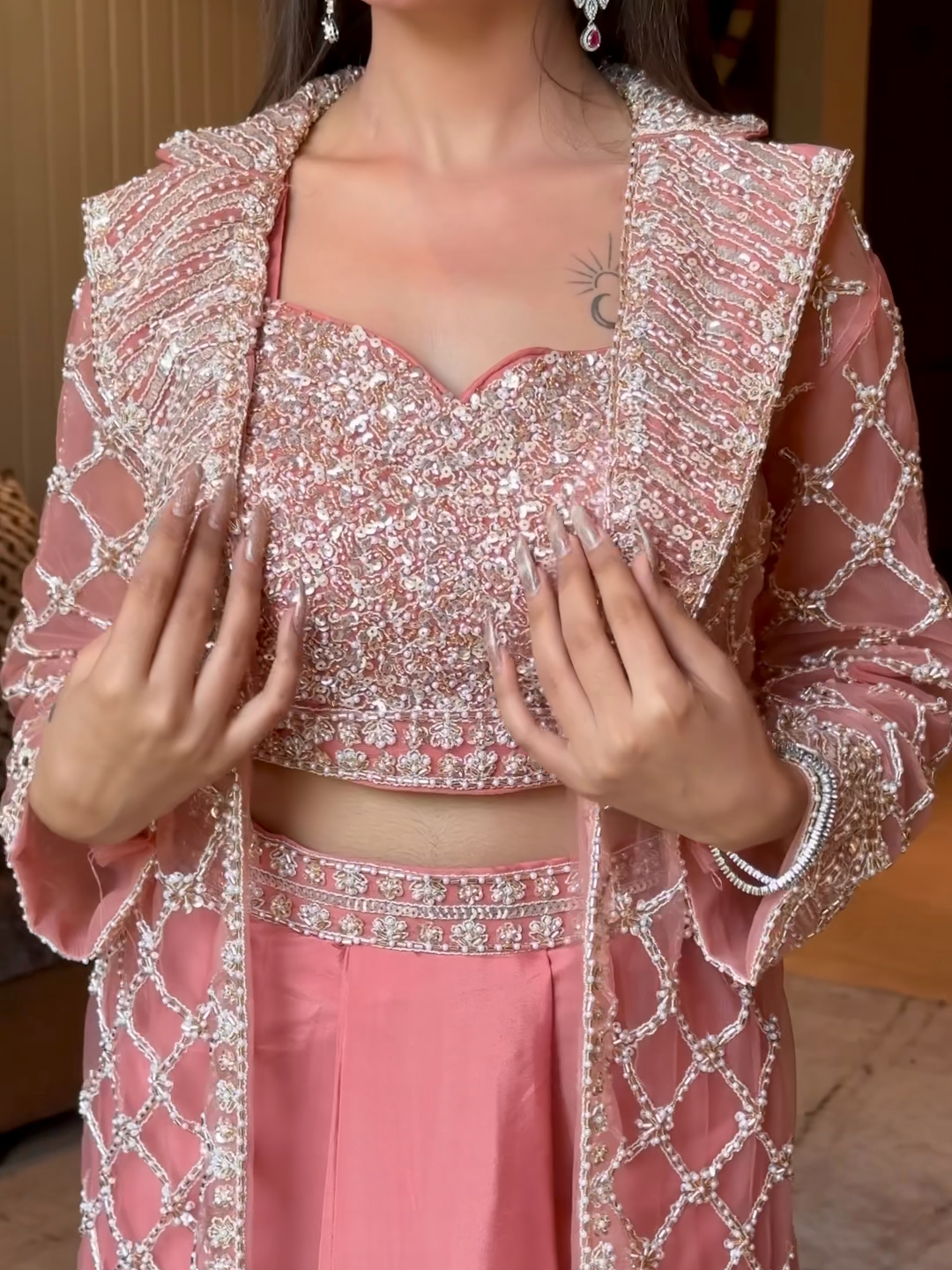 Net Heavy Sequin Embroidered Crop Top with Dhoti and Full Sleeve Embroidered Jacket in Peach