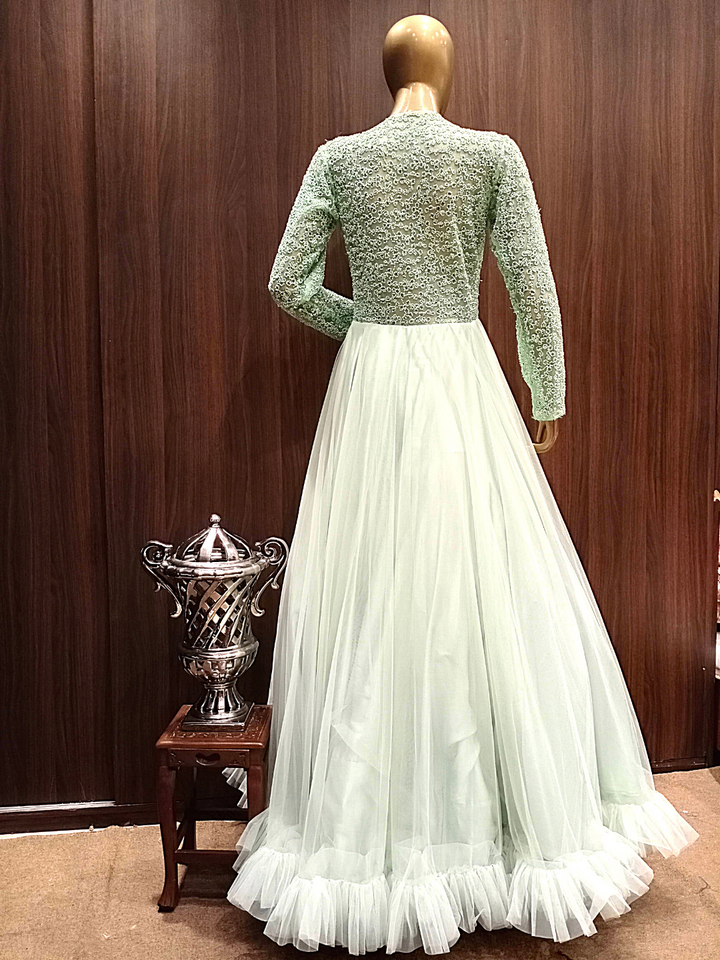 Pastel Green Flared Gown With Ruffled Hemline and Thread Embroidery