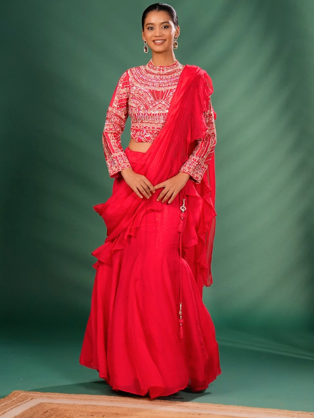 Intricate Embroidery with Floral Motifs & Sequin Detailing Blouse and Ruffled Lehenga with attached Dupatta