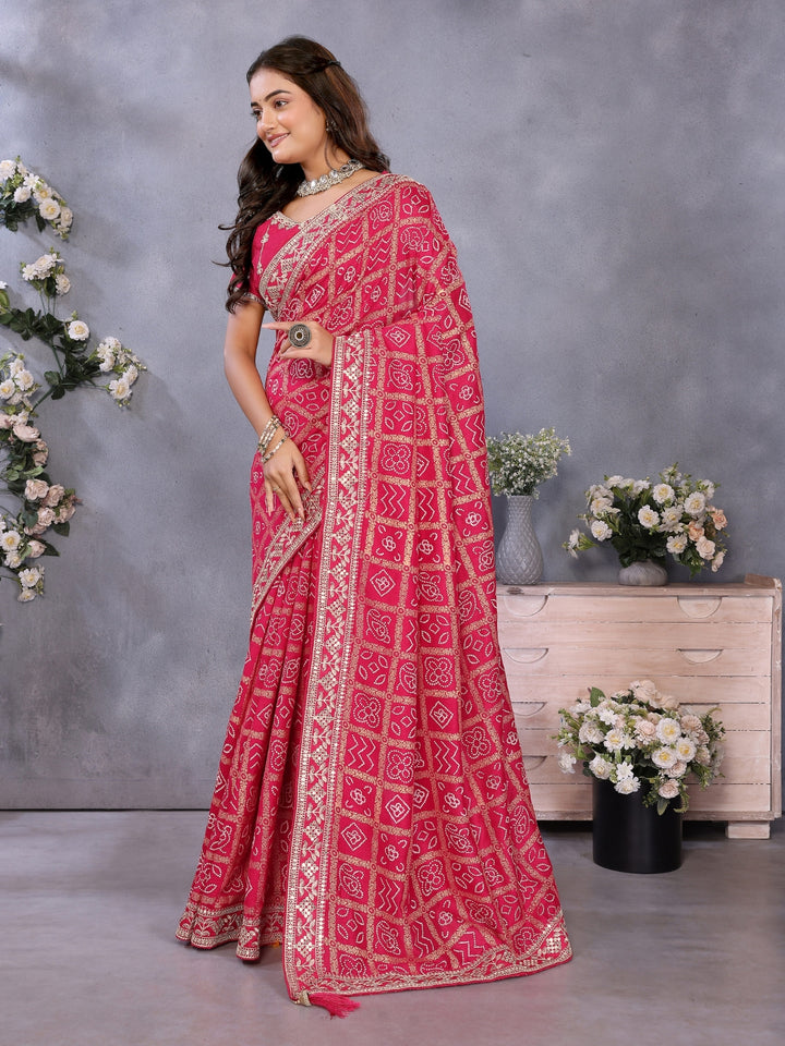 Bandhani-print saree with zari & mirror embellished border and embroidered blouse.