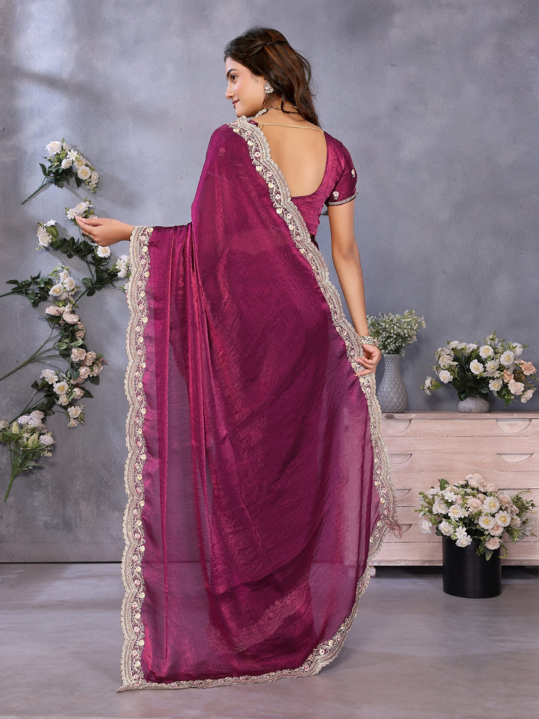 Solid saree with embellished scalloped border and zari-embroidered blouse.