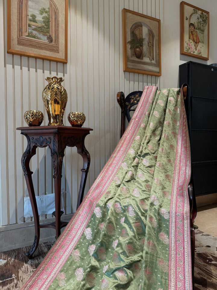 Pastel Green Pink Zari Butta Woven Banarasi Art Silk Saree with Contrast Pallu Border.