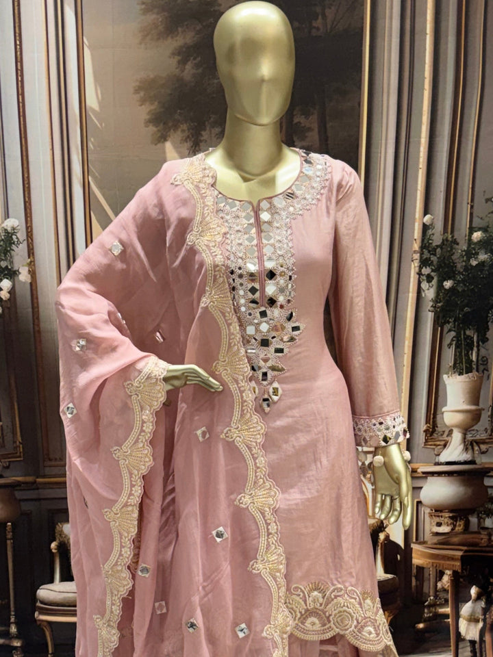 Mirror-work embroidered kurta set with scalloped dupatta and straight pants.