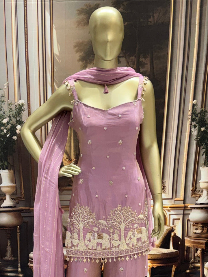Art silk kurta palazzo set with pearl, bead & zari elephant scene embroidery.