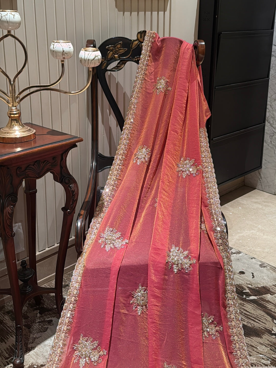 Peach-Pink Shimmer Saree with Golden Sequin Floral Motifs & Heavy Embellished Border