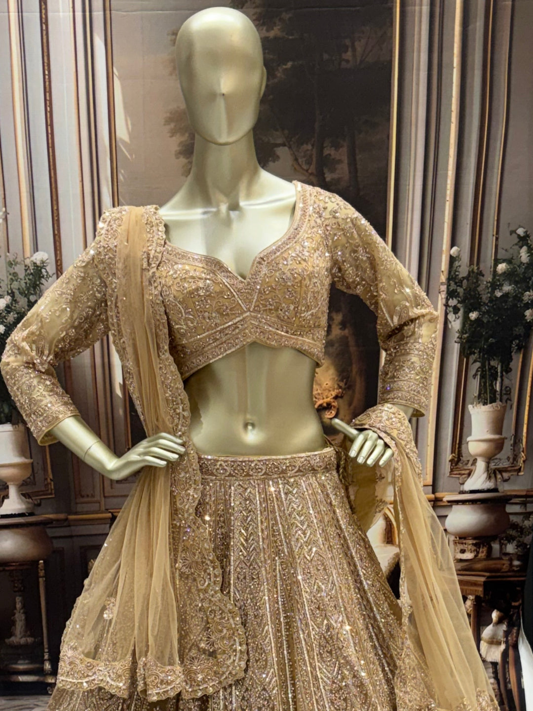 Champagne gold heavy sequin embroidered net lehenga set with scalloped border dupatta.