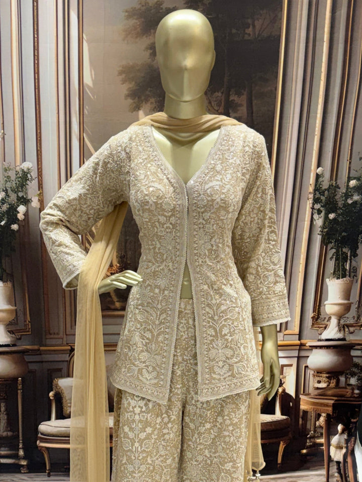Ivory all-over thread embroidered kurta palazzo set with sequins and tasselled dupatta.