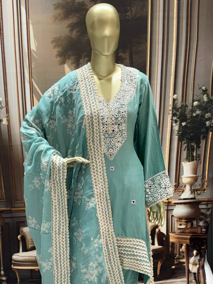 Silk-blend embroidered kurta set with mirror-work yoke & scallop lace dupatta.