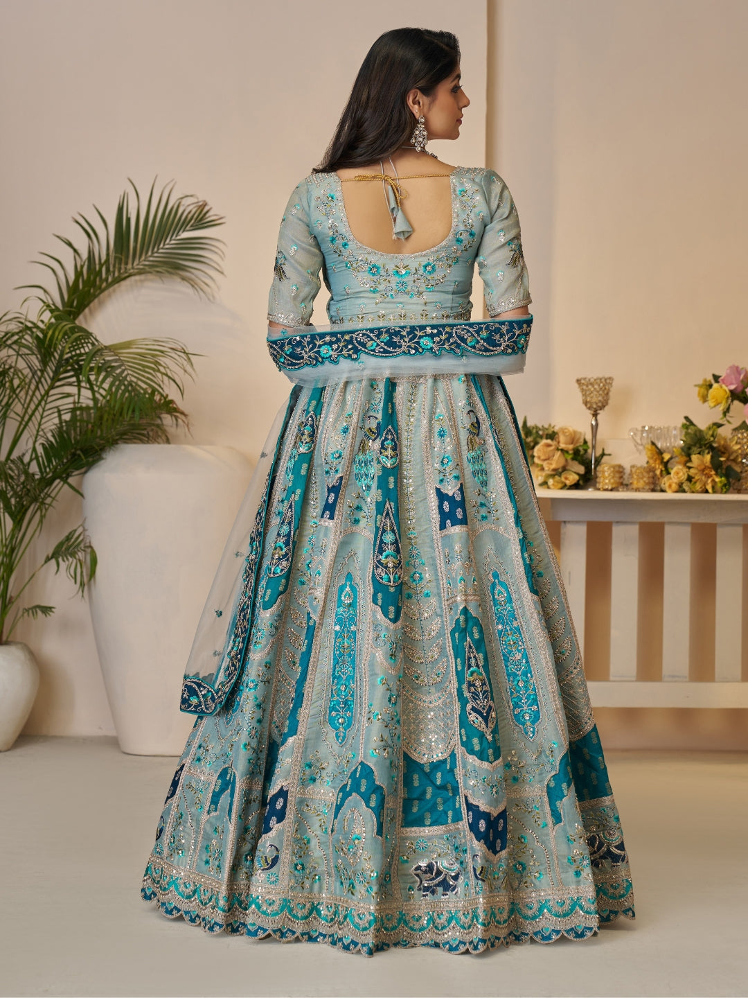 Sequined & thread embroidered georgette lehenga choli with embellished dupatta.