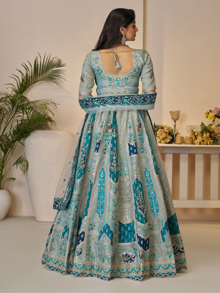 Sequined & thread embroidered georgette lehenga choli with embellished dupatta.