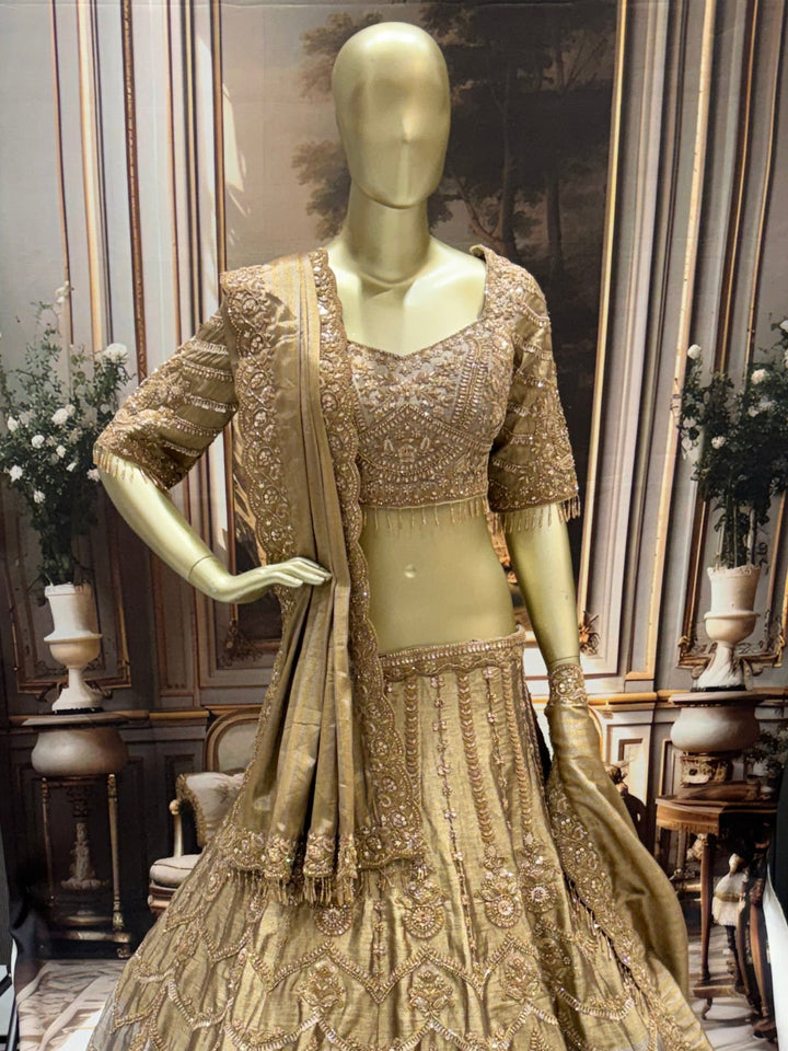 Art silk lehenga set with heavy zari, sequin embroidery & scalloped dupatta.