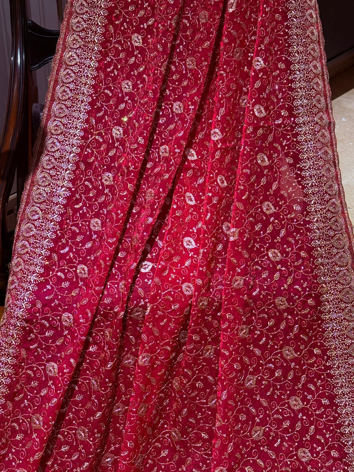Pinkish Red Saree with Heavy Golden Zari Embroidery & Ornate Floral Motif Border Work