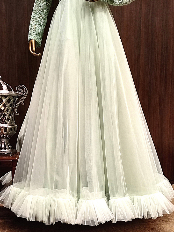Pastel Green Flared Gown With Ruffled Hemline and Thread Embroidery