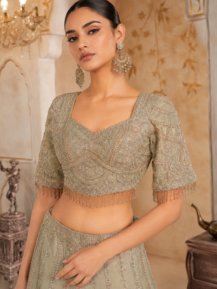 Sage Green Ombre Silk Bridal Lehenga Choli with Heavy Zari, Resham & Cutdana Floral Embroidery with Crystal Tassel Hem & Dupatta