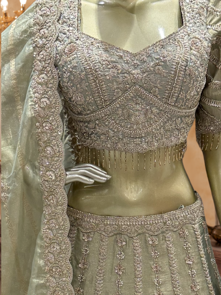 Sage Green Ombre Silk Bridal Lehenga Choli with Heavy Zari, Resham & Cutdana Floral Embroidery with Crystal Tassel Hem & Dupatta