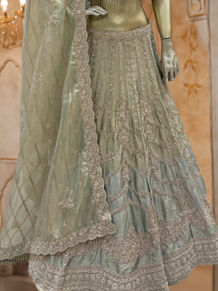 Sage Green Ombre Silk Bridal Lehenga Choli with Heavy Zari, Resham & Cutdana Floral Embroidery with Crystal Tassel Hem & Dupatta
