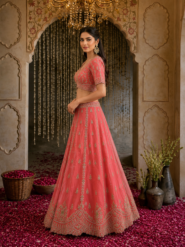 Coral Pink Silk Lehenga Choli with Zari, Sequin & Pearl Floral Booti Embroidery with Pearl Tassel Hem & Net Dupatta