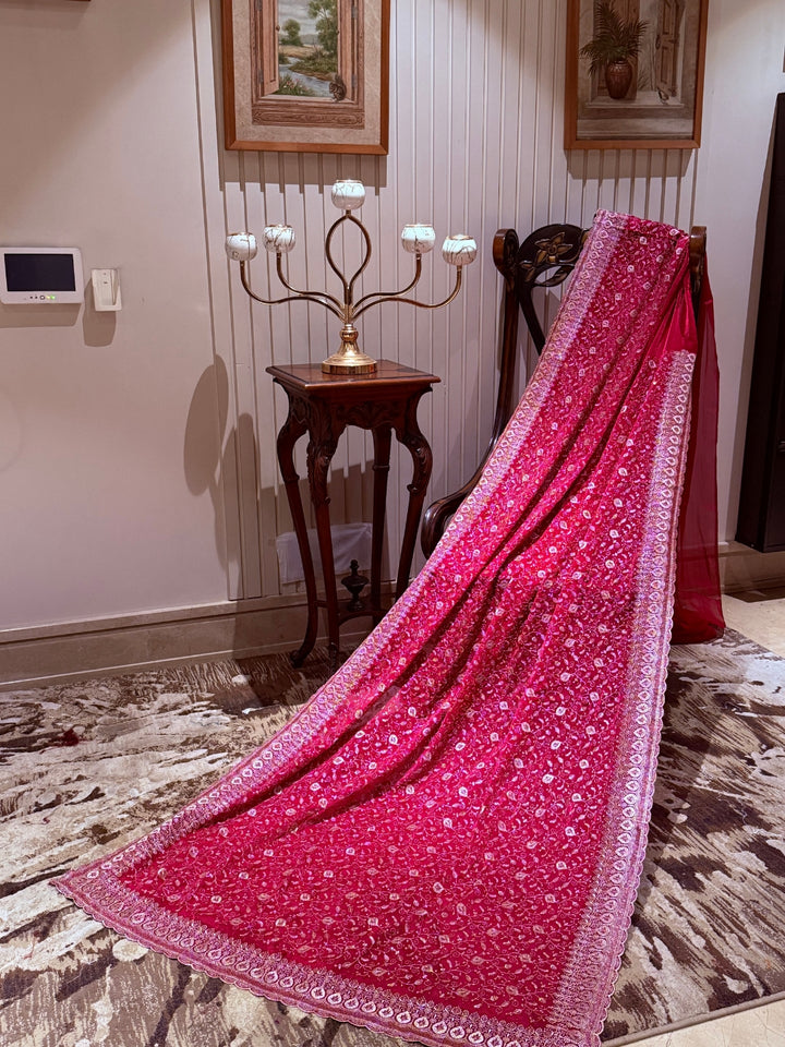 Pinkish Red Saree with Heavy Golden Zari Embroidery & Ornate Floral Motif Border Work