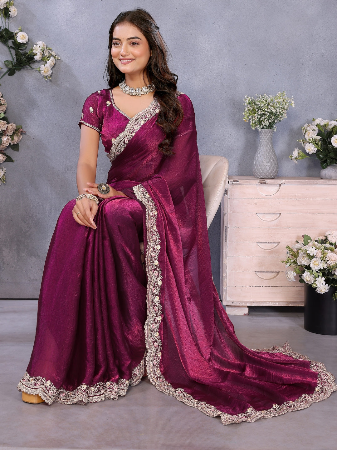 Solid saree with embellished scalloped border and zari-embroidered blouse.
