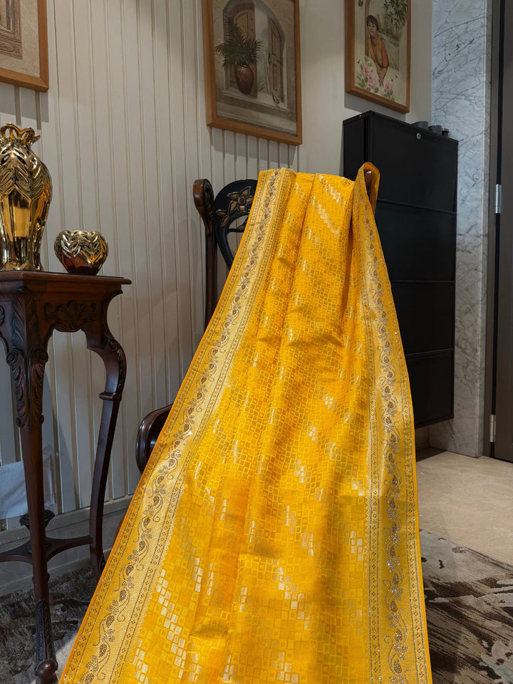 Yellow Banarasi Woven Checks Saree with Intricate Zari Border and Tasselled Pallu