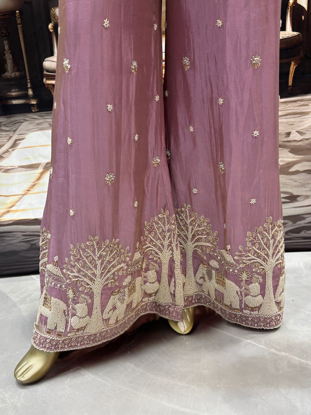 Art silk kurta palazzo set with pearl, bead & zari elephant scene embroidery.