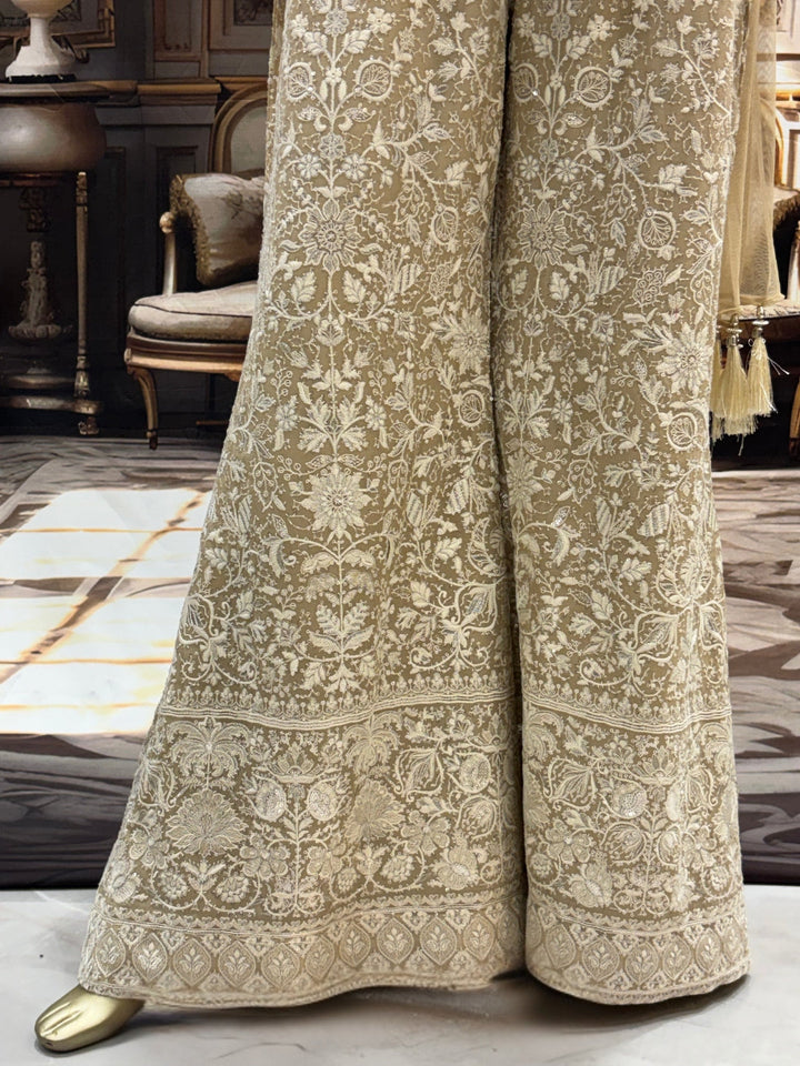 Ivory all-over thread embroidered kurta palazzo set with sequins and tasselled dupatta.