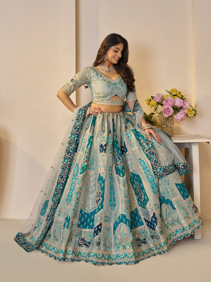 Sequined & thread embroidered georgette lehenga choli with embellished dupatta.