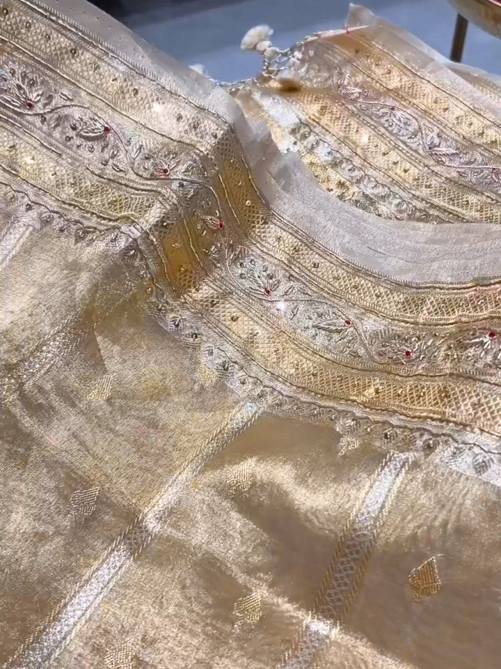 Beige color Beads & Stones Worked Border with Ethnic Motifs Zari woven traditional saree