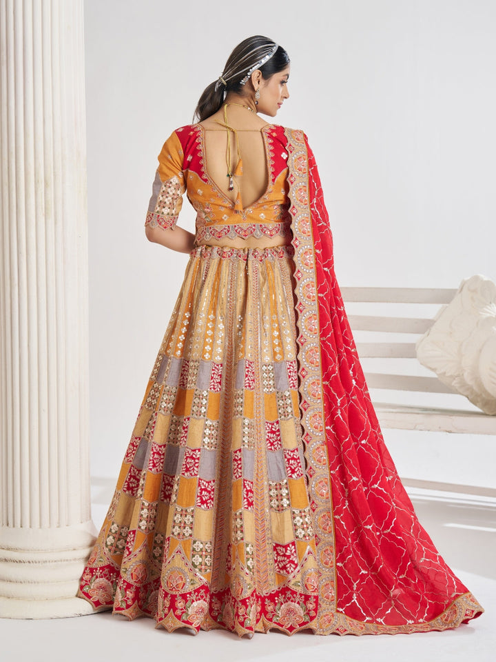 Multi-colour patchwork lehenga choli with mirror, zari & gota embroidery and bandhani dupatta.
