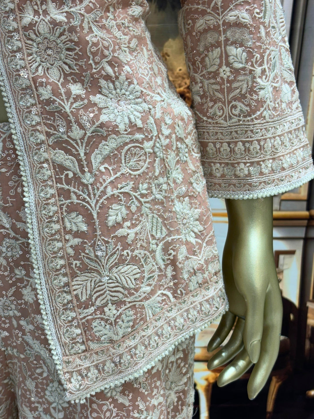 Thread embroidered kurta palazzo set with sequins and tasselled dupatta.