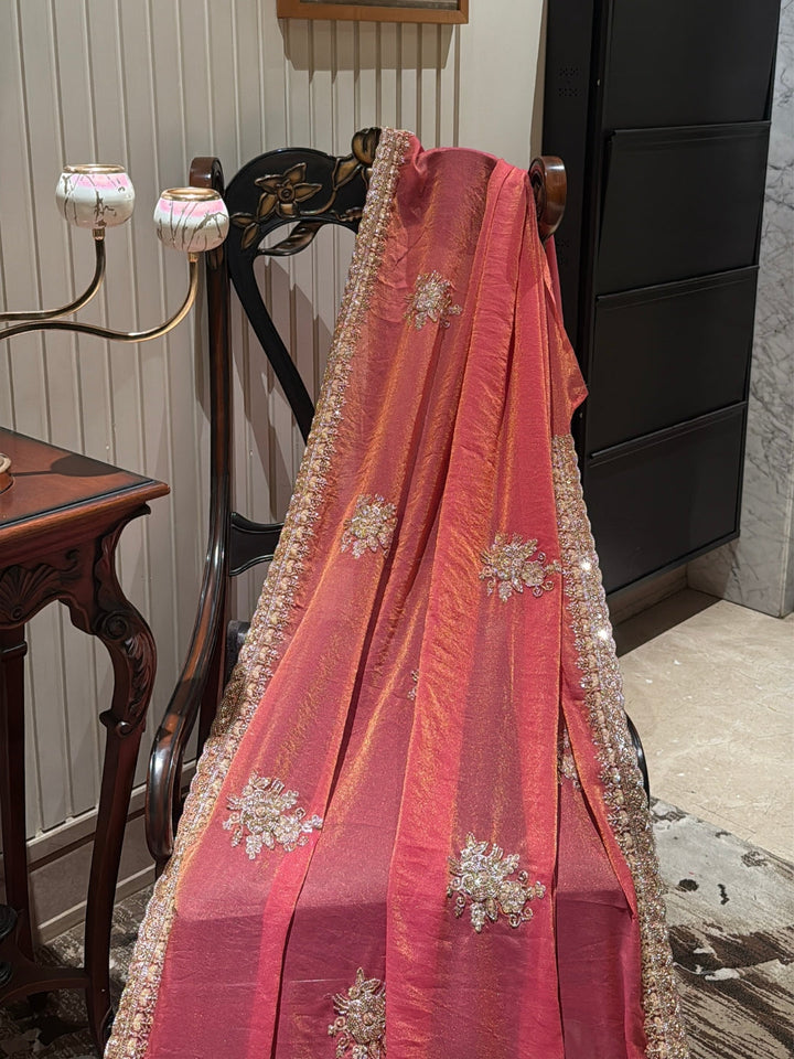 Peach-Pink Shimmer Saree with Golden Sequin Floral Motifs & Heavy Embellished Border