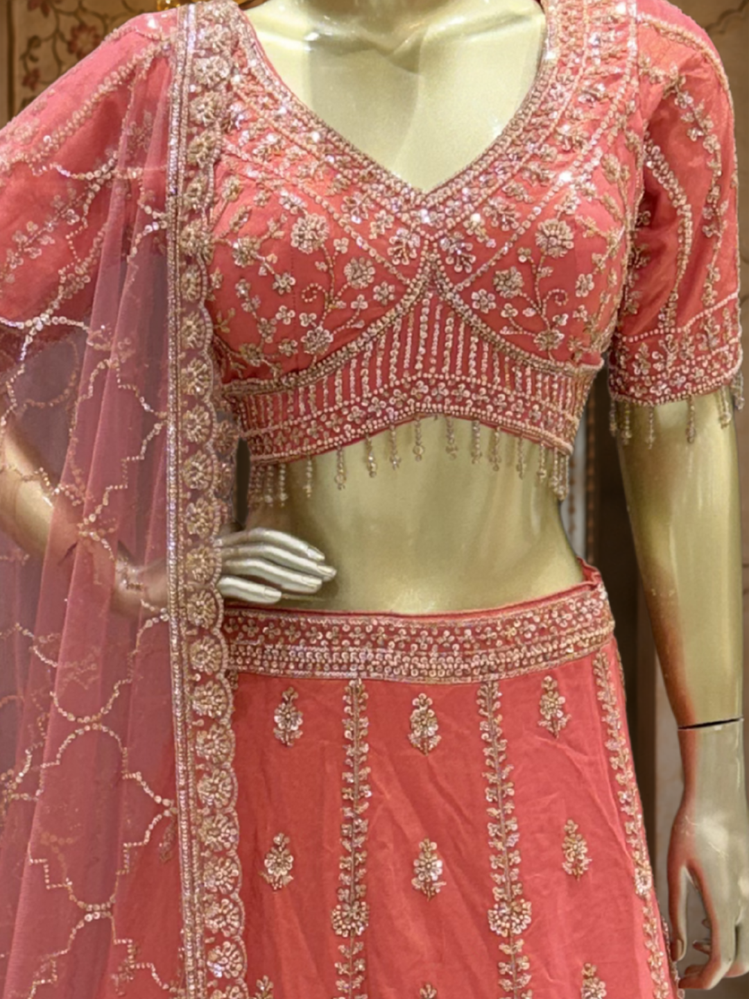 Coral Pink Silk Lehenga Choli with Zari, Sequin & Pearl Floral Booti Embroidery with Pearl Tassel Hem & Net Dupatta