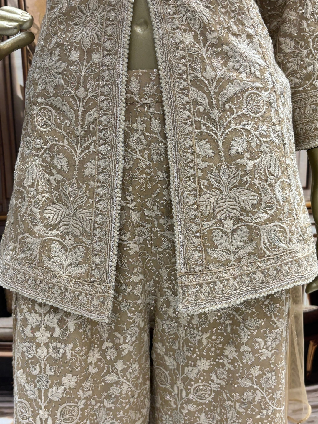 Ivory all-over thread embroidered kurta palazzo set with sequins and tasselled dupatta.