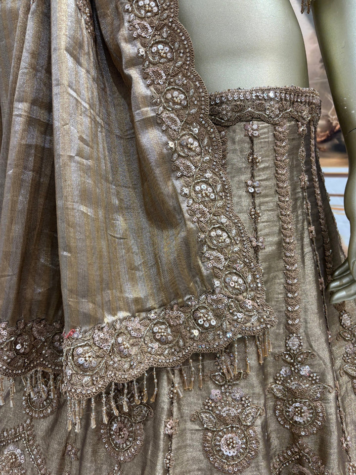 Art silk lehenga set with heavy zari, sequin embroidery & scalloped dupatta.