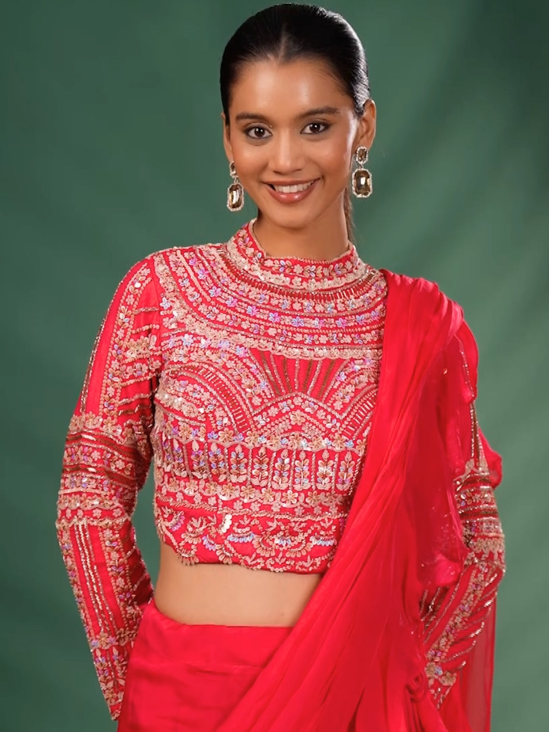 Intricate Embroidery with Floral Motifs & Sequin Detailing Blouse and Ruffled Lehenga with attached Dupatta