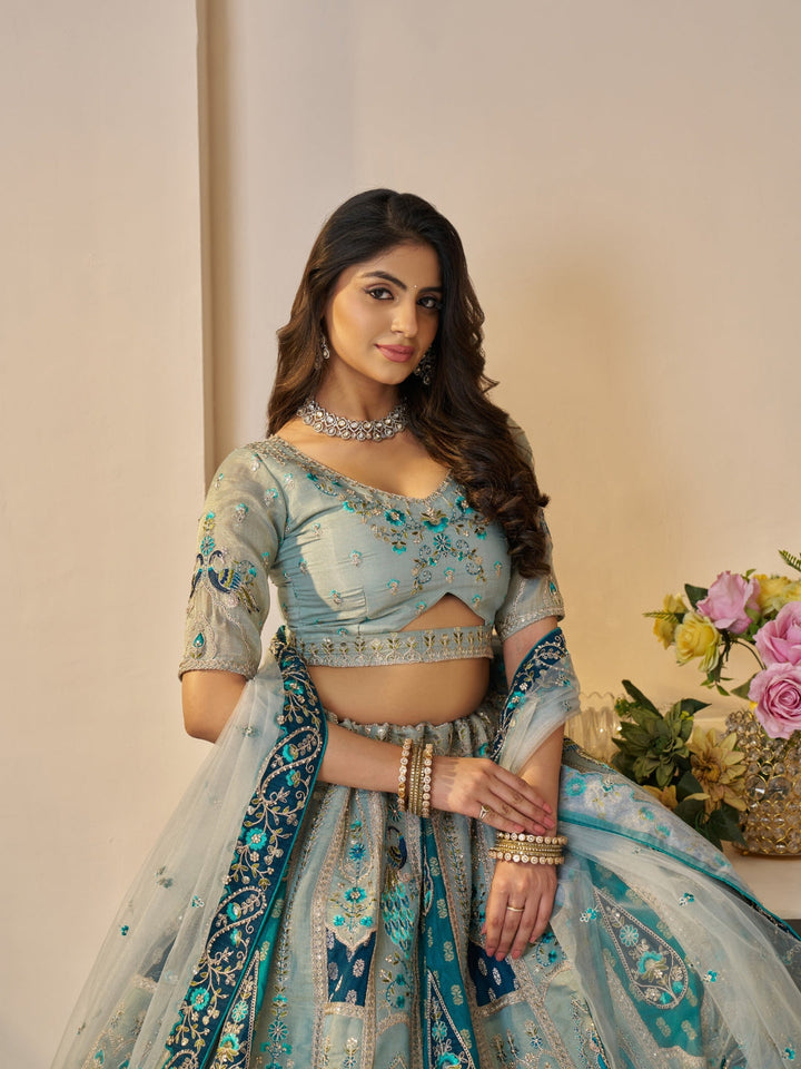 Sequined & thread embroidered georgette lehenga choli with embellished dupatta.