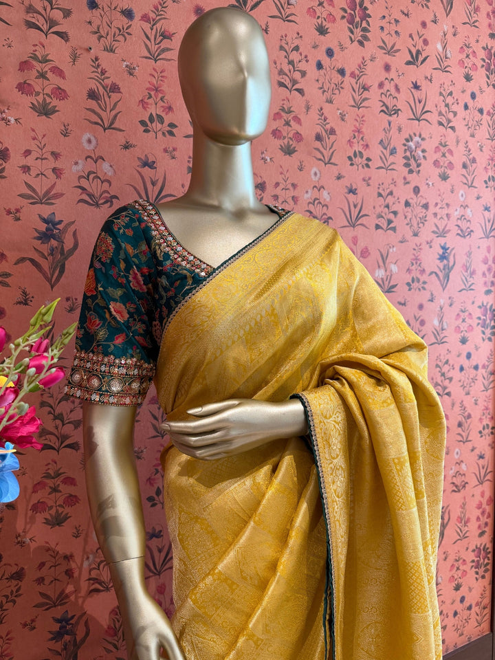Yellow Jacquard Silk Woven Zari Saree with Slim Embellished Border for Festive Haldi Wear.